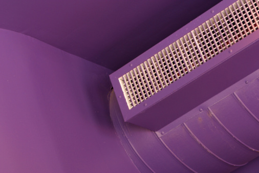 Air conditioner on purple walls